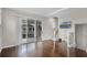 Bright living room with hardwood floors, sliding glass doors to balcony, and staircase at 1795 Piedmont Pl, Lake Mary, FL 32746