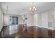 Bright living room with hardwood floors, recessed lighting, and sliding glass doors to the balcony at 1795 Piedmont Pl, Lake Mary, FL 32746
