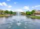 Scenic pond view featuring a fountain and bridge connecting to the buildings in this community at 1795 Piedmont Pl, Lake Mary, FL 32746
