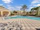 Community pool with a checkered tile patio and lounge chairs for relaxing by the water at 1795 Piedmont Pl, Lake Mary, FL 32746