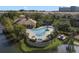Aerial view of a community pool and spa surrounded by tropical plants and landscaping at 1795 Piedmont Pl, Lake Mary, FL 32746