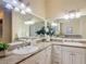 Well-lit bathroom features a double sink vanity with granite countertops at 1842 Lake Ridge Dr, The Villages, FL 32162