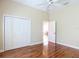 Neutral bedroom with closet and ceiling fan at 1842 Lake Ridge Dr, The Villages, FL 32162