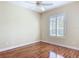 Cozy bedroom with wood floors and window with shutters at 1842 Lake Ridge Dr, The Villages, FL 32162