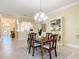 Open concept dining room with access to the kitchen, and living areas at 1842 Lake Ridge Dr, The Villages, FL 32162