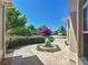 Inviting front yard with lush landscaping, a unique water feature, and a well-maintained walkway at 1842 Lake Ridge Dr, The Villages, FL 32162