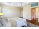 Spacious main bedroom with ceiling fan, en-suite bathroom, and walk-in closet at 1842 Lake Ridge Dr, The Villages, FL 32162