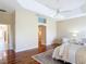 Well-lit main bedroom features tray ceiling, ceiling fan, and en-suite bathroom at 1842 Lake Ridge Dr, The Villages, FL 32162