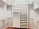 Walk-in closet with custom shelving and ample storage space at 1842 Lake Ridge Dr, The Villages, FL 32162