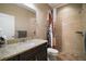 Bright bathroom featuring a granite vanity, shower with stylish curtain, and tiled floors for a fresh, clean look at 1893 Banning Beach Rd, Tavares, FL 32778