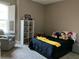 Neutral bedroom filled with toys and decorations featuring natural light at 1893 Banning Beach Rd, Tavares, FL 32778