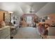 Eclectic bedroom with ceiling fan and natural light, decorated with colorful artwork and guitars at 1893 Banning Beach Rd, Tavares, FL 32778