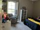Cozy bedroom with ample natural light, a comfortable chair, and decorations at 1893 Banning Beach Rd, Tavares, FL 32778