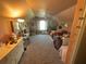 Cozy bedroom with a bed, dresser, and a window with ample natural light at 1893 Banning Beach Rd, Tavares, FL 32778