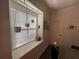 Bright dining area with a window, minimalist decor, and comfortable seating at 1893 Banning Beach Rd, Tavares, FL 32778
