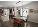 Modern dining area with stylish lighting and seamless kitchen access at 1893 Banning Beach Rd, Tavares, FL 32778