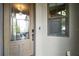 Elegant front entry features a decorative glass door and a sidelight window at 1893 Banning Beach Rd, Tavares, FL 32778