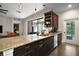 Open kitchen featuring granite countertops, stainless steel appliances, and a breakfast bar at 1893 Banning Beach Rd, Tavares, FL 32778