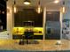 Close up of kitchen featuring stainless steel appliances, granite countertops, and breakfast bar at 1893 Banning Beach Rd, Tavares, FL 32778