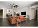 Cozy living room featuring tile floors, stylish furnishings, and ample natural light at 1893 Banning Beach Rd, Tavares, FL 32778
