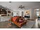 Open living space featuring a comfortable leather sofa, tile flooring, and kitchen access at 1893 Banning Beach Rd, Tavares, FL 32778