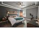 Serene main bedroom with tray ceiling, stylish decor, and exercise equipment for a healthy lifestyle at 1893 Banning Beach Rd, Tavares, FL 32778
