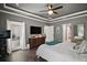 Elegant main bedroom featuring a large window, balcony, and sophisticated furnishings, perfect for relaxation at 1893 Banning Beach Rd, Tavares, FL 32778