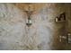 Stunning shower with marble walls, rain shower head, and built-in shelves for convenient storage and elegant design at 1893 Banning Beach Rd, Tavares, FL 32778