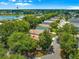 Aerial view of a single-story home in a community that has a large lake nearby at 2102 Estevez Dr, Lady Lake, FL 32159