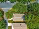 An aerial view showcases this single-story home's location within a well-maintained community near major thoroughfares at 2102 Estevez Dr, Lady Lake, FL 32159