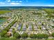 Overhead view of a cozy neighborhood with well-spaced houses and easy access to nearby lakes and green spaces at 2102 Estevez Dr, Lady Lake, FL 32159
