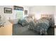 Cozy bedroom featuring two twin beds and a large window at 2102 Estevez Dr, Lady Lake, FL 32159