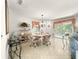 Bright dining area with stylish decor, natural light, and an open layout perfect for entertaining and modern living at 2102 Estevez Dr, Lady Lake, FL 32159