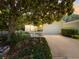 Charming single-story home featuring a well-maintained yard, lovely landscaping, and a welcoming two-car garage at 2102 Estevez Dr, Lady Lake, FL 32159