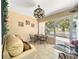Relaxing sunroom with comfortable seating, stylish decor, and a bright, welcoming atmosphere at 2102 Estevez Dr, Lady Lake, FL 32159