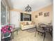 Relaxing sunroom with comfortable seating, stylish decor, and a bright, welcoming atmosphere at 2102 Estevez Dr, Lady Lake, FL 32159
