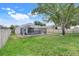 Large backyard with pool, screened patio, lush lawn, and privacy fence at 2136 Fish Eagle St, Clermont, FL 34714