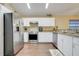 Modern kitchen with stainless steel appliances and ample cabinet space at 2136 Fish Eagle St, Clermont, FL 34714