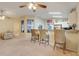 Open layout features breakfast bar with seating and an adjoining living area at 2136 Fish Eagle St, Clermont, FL 34714