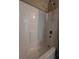 Clean bathroom featuring a shower and bathtub combo with tiled walls at 222 Locust Ln, Ocala, FL 34471