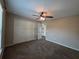 Spacious bedroom with carpeted floors, ceiling fan, and double door closet provides comfort and convenience at 222 Locust Ln, Ocala, FL 34471