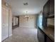 Bright dining area featuring tile floors, modern lighting fixture, and natural light from the adjacent window at 222 Locust Ln, Ocala, FL 34471