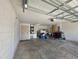 View of the garage space showing an automatic door, and a door into the home at 222 Locust Ln, Ocala, FL 34471