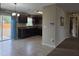 Bright kitchen leading to the backyard with tile floors, dark cabinets, and modern appliances at 222 Locust Ln, Ocala, FL 34471