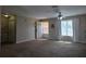 Bright living room featuring neutral colors, carpeted floor, and ample natural light at 222 Locust Ln, Ocala, FL 34471