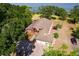 Expansive aerial view of the home showcasing the large property and beautiful lake views at 2400 N Griffin Dr, Leesburg, FL 34748