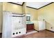 Charming bathroom featuring a tub with shower, vanity with sink, decorative wall paneling and stylish accents at 2400 N Griffin Dr, Leesburg, FL 34748