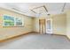 Bonus room featuring carpet, bright windows and access to the exterior at 2400 N Griffin Dr, Leesburg, FL 34748