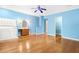 Bonus room with hard wood floors, a ceiling fan, sink, cabinets and doorway that leads to an adjoining room at 2400 N Griffin Dr, Leesburg, FL 34748