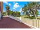 Exterior shot featuring a wooden deck and lake view at 2400 N Griffin Dr, Leesburg, FL 34748